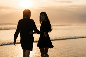 Young couple in love, Attractive man and woman enjoying romantic evening on sunset