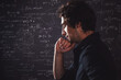 © Ulia Koltyrina - Human intellect. Training and research, concept. Pensive man and physical and mathematical formulas