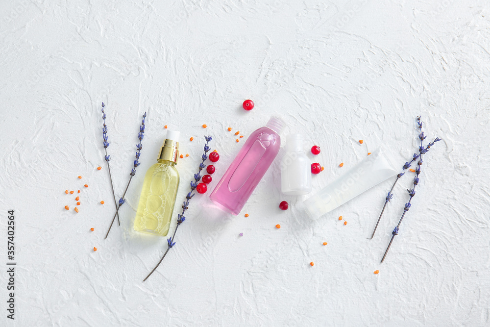 Natural cosmetics with ingredients on white background