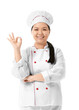 © Pixel-Shot - Beautiful Asian chef showing OK gesture on white background