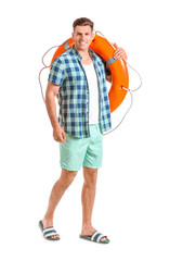 Wall Mural - Young man with lifebuoy on white background