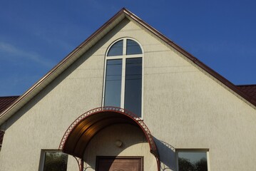 Sticker - gray concrete loft with one white window against a blue sky