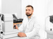 © Ievgen Skrypko - doctor working with ophthalmological equipment in clinic