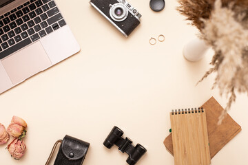 Trendy flat lay with autumn workspace on beige bac