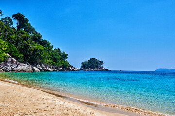 Wall Mural - Gold sand beach and turquoise sea background. Coastline on sunny day background of sea and sky, gold sand, tourism, relax, vacation, summer, ocean. Tioman Island, Malaysia.