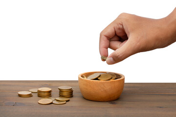 Saving money concept hand putting money coin stack.