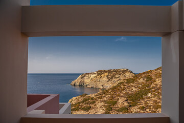 View of the island in the sea through the window