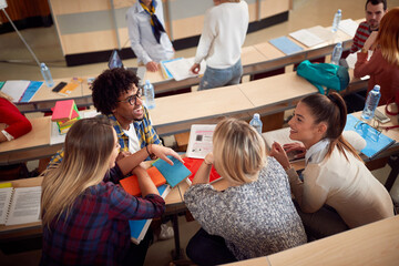 Wall Mural - Students laughing while having lecture