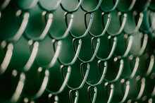 Artistic Moody Green Metal Wire Fence Pattern Close Up