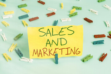 Poster - Handwriting text writing Sales And Marketing. Conceptual photo Business Advertising, Promotion, and Commercial Strategy Colored clothespin papers empty reminder blue floor background office pin
