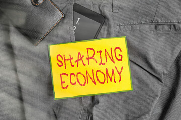 Poster - Conceptual hand writing showing Sharing Economy. Concept meaning a system where assets are shared privately between individuals Smartphone device inside trousers front pocket with wallet