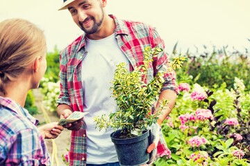 Wall Mural - Gardener working at garden centre