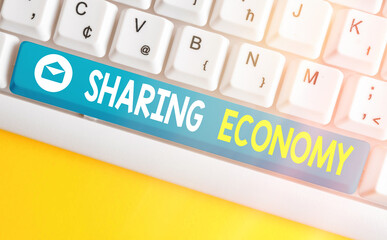Poster - Text sign showing Sharing Economy. Business photo showcasing a system where assets are shared privately between individuals