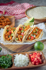 Wall Mural - mexican shredded chicken tacos with ingredients