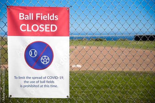 Malibu, CA - June 13, 2020: Sign posted at baseball fields in Malibu park. To slow the spread of COVID-19, soccer and ball fields are closed and sports play is prohibited.