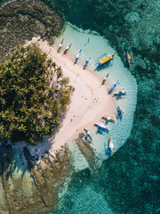 Aerial photos of Guyam Island, a tear-drop shaped island in the Philippine Sea situated around 2 kilometres south-southeast of General Luna municipality. Popular stop for tourists doing island-hopping