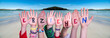 Children Hands Building Colorful German Word Erziehen Means Educate. Ocean And Beach As Background