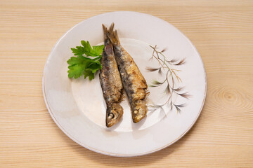 Wall Mural - grilled fish, sardines or anchovies with parsley