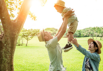 Wall Mural - happy family playing on the park