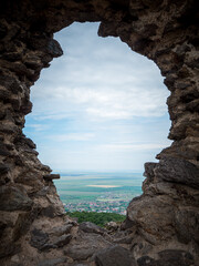 broken wall. view from the fortress to the village. hole to heaven