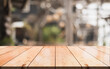 © DEEP PIXEL - Empty wooden table top with lights bokeh on blur restaurant background. You can mock up your product