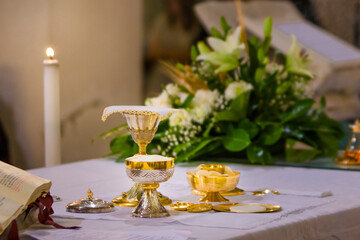 Wall Mural - altar with host and chalice with wine in the churches of the pope of rome, francesco