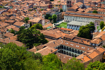 Wall Mural - Panoramic, aerial view of the historic centre of Brescia, Lombardy, Italy. Traditional medieval Europe with tiled red roofs, narrow streets, stone houses, Duomo,  Clock tower. Heritage. Architecture.