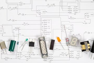 Different electronic parts or components on pcb wiring scheme with resistors, capacitors, diode and ic chips, flat lay top view from above