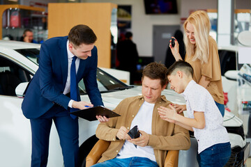 man have no money to buy specific car in dealership, helpful consultant offers cheapest options represented for sale