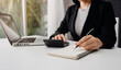 © ARMMY PICCA - businesswoman hand using smart phone, tablet payments and holding credit card online shopping, omni channel, digital tablet docking keyboard computer at office in sun light