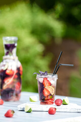 Poster - Delicious refreshing lemonade with basil, lime and strawberries. Summer drink with ice. Home made production.