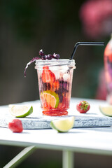 Poster - Delicious refreshing lemonade with basil, lime and strawberries. Summer drink with ice. Home made production.