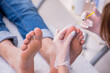 © Elnur - Podiatrist treating feet during procedure