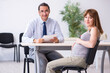 © Elnur - Pregnant woman visiting male psychologist doctor