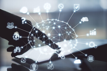 Leinwandbilder - Hand using tablet with creative ai circuit brain and icons