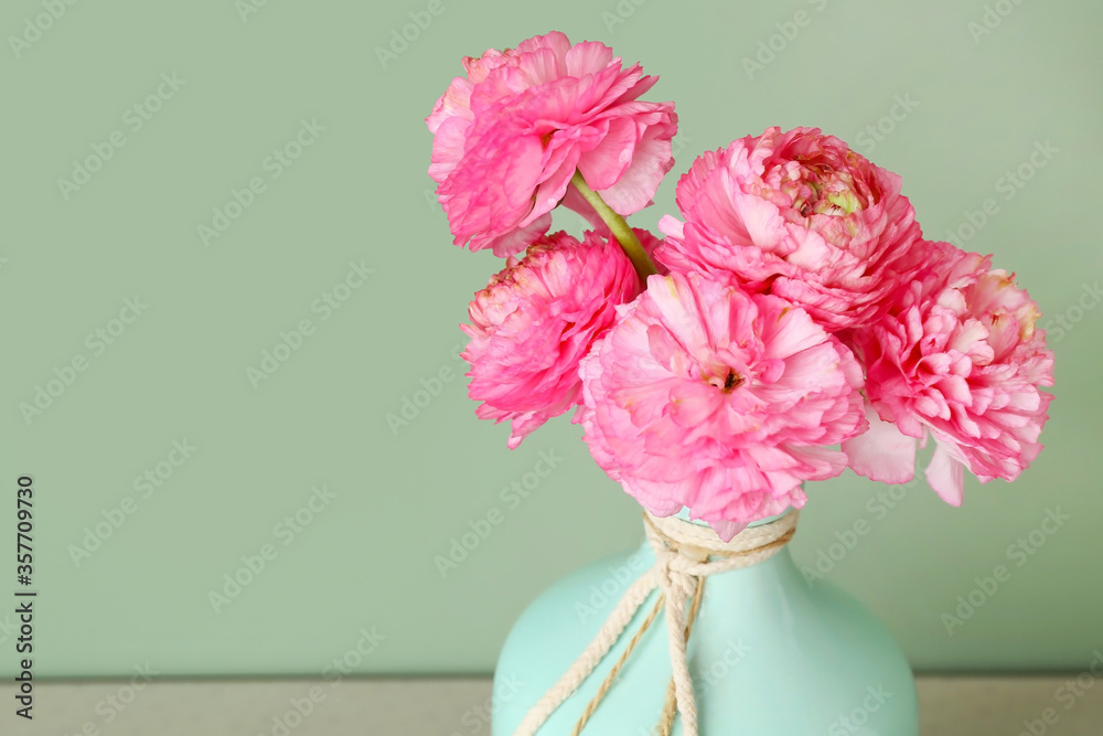 Vase with beautiful flowers on color background