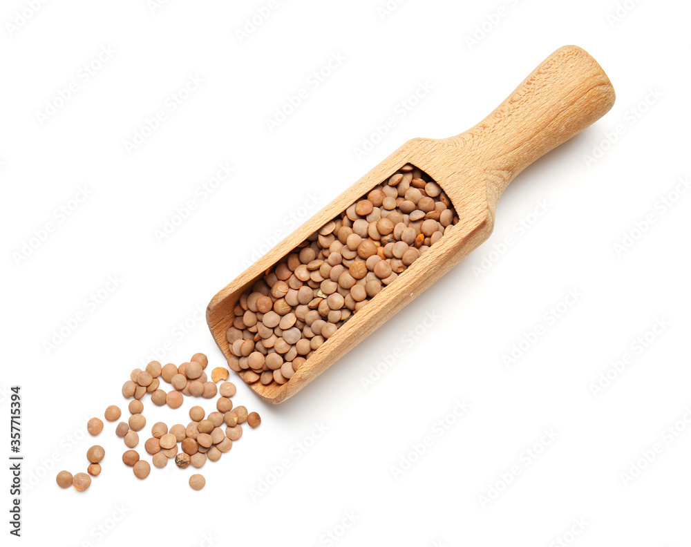 Scoop with lentils on white background
