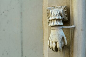 Sticker - Shot of a carved stone hand holding a stone ball