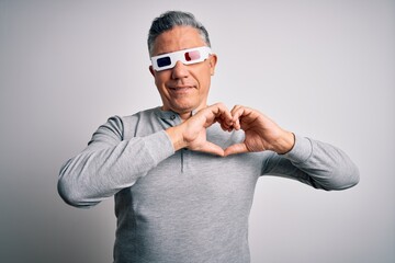 Poster - Middle age handsome grey-haired man using 3d glasses over isolated white background smiling in love showing heart symbol and shape with hands. Romantic concept.