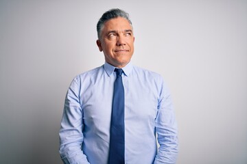 Poster - Middle age handsome grey-haired business man wearing elegant shirt and tie smiling looking to the side and staring away thinking.