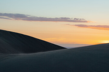 Wall Mural - view of sand dunes during sunrise
