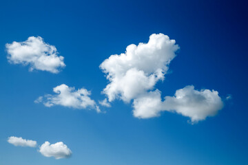 Wall Mural - white, fluffy clouds in blue sky. background from clouds