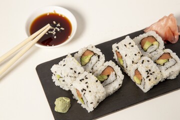 Sticker - Pieces of sushi next to each other on a black surface