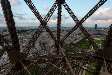 Wall Mural - Paris panorama view front Eiffel tower lift throughout the steel bars screwed to each others, France