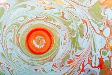 Canvas Print - Closeup shot of a circular orange shape surrounded by green patterns