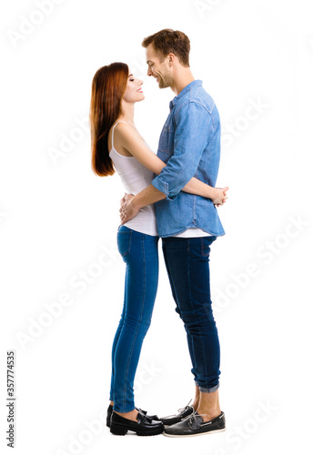 Profile Side Of Smiling Happy Couple Full Body Length Portrait Image Of Standing Close And Looking