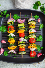 Wall Mural - Grilled vegetable skewers in grill pan, top view. Vegan food concept.