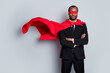 © deagreez - Brave courage afro american man day he agent collar night strong superman cross hands ready save world wear red costume blazer pants tuxedo tie isolated gray color background