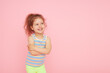© oes - Portrait of cute little child girl with a snow-white smile and healthy teeth over pink background. looking at the camera and laughing. Dentistry for children