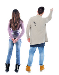 Sticker - Back view of couple in sweater pointing.